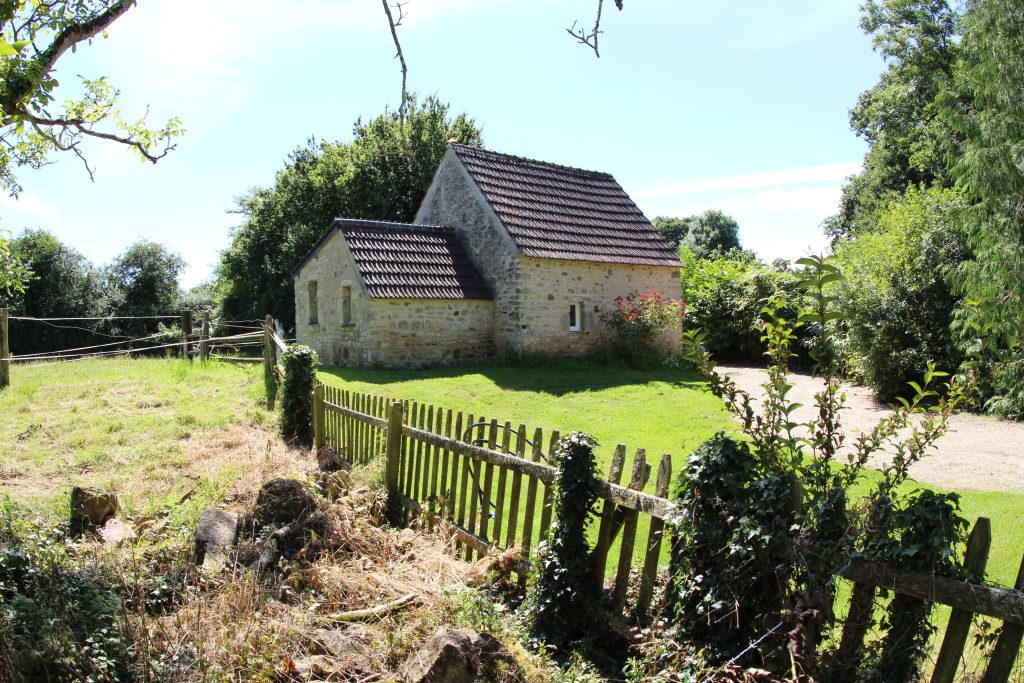 La Boulangerie cottage facing the château at Château de Flottemanville, Normandy