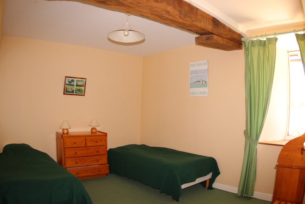 Green bedroom of La Ferme cottage at Château de Flottemanville