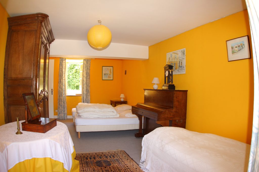 Ground floor bedroom of La Ferme cottage at Château de Flottemanville