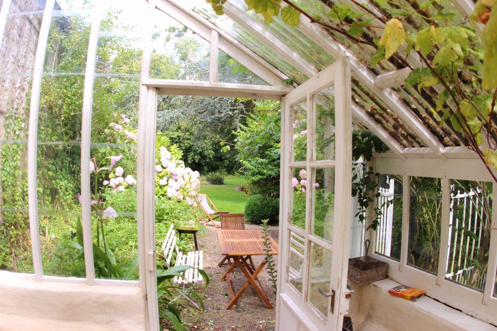 Glass conservatory of La Serre cottage at Château de Flottemanville