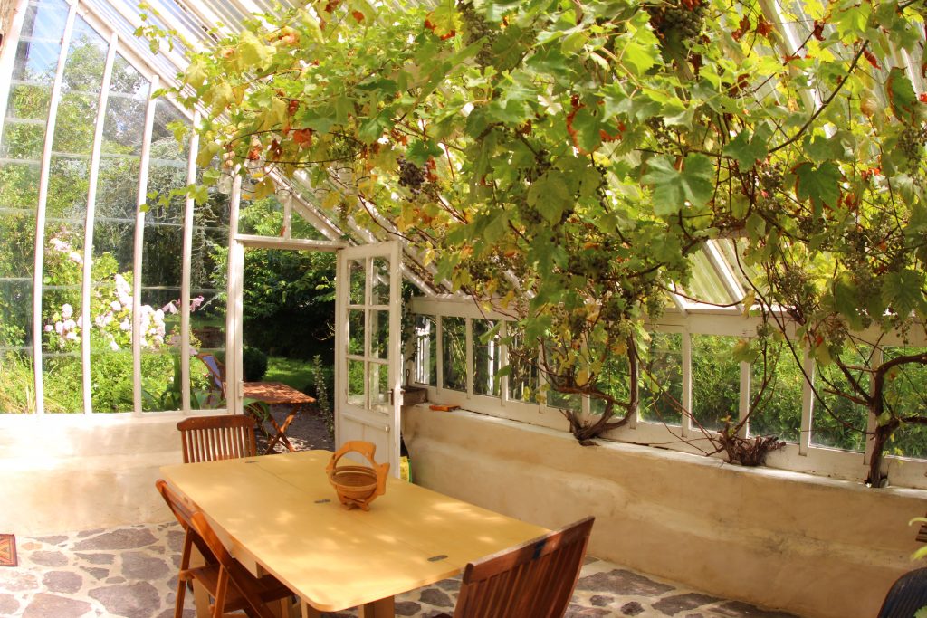 The greenhouse conservatory of La Serre cottage at Château de Flottemanville