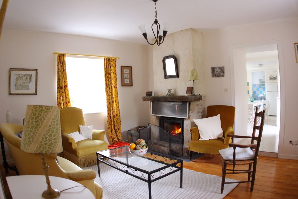 Living room of Les Pommiers cottage at Château de Flottemanville